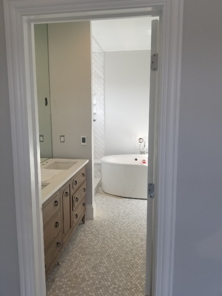wood vanity restoration hardware mirror sconces polished nickel quartz freestanding tub tub filler kohler